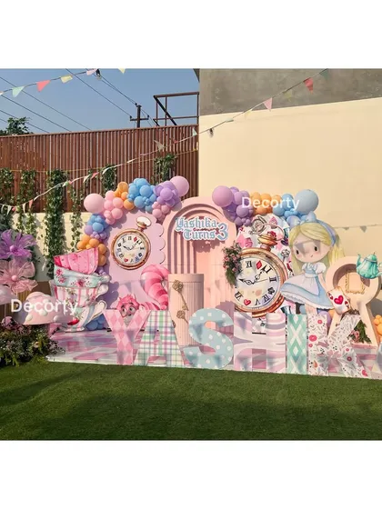 A wide perspective of the whimsical stage, perfect for a sunny outdoor celebration.