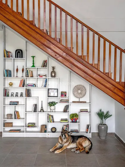 A closer look at the under-stair library, a clever storage solution that turns a transitional space into a functional and aesthetic feature.