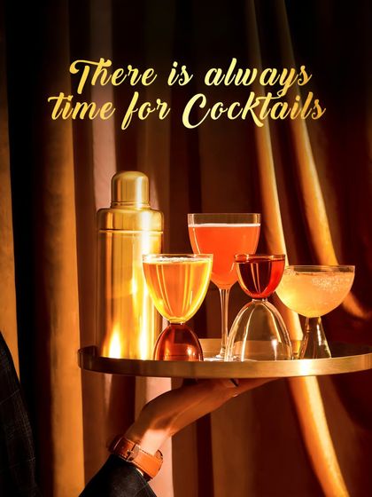 There is always time for cocktails. A tray of our elegant, golden-hued drinks ready to be served, showcasing the variety and sophistication we bring to your event.