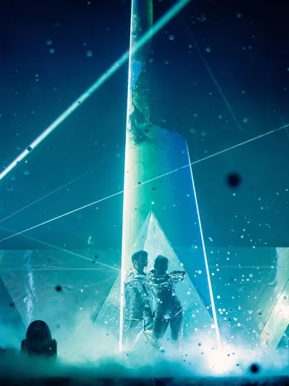 For couples who want something modern and edgy, I create high-tech experiences like this laser-programmed entry. I spent weeks syncing the laser patterns and light beams with the music to build suspense before the final, dramatic reveal.