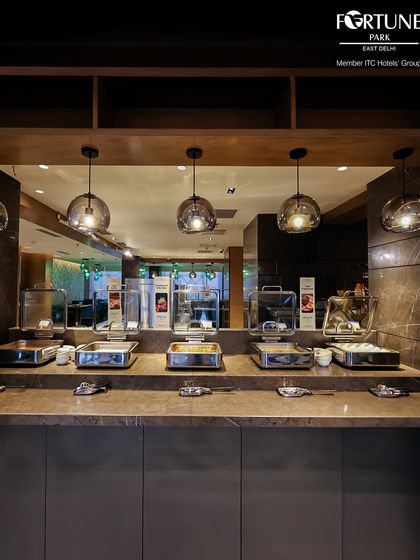 The main buffet line at Zodiac, showcasing the sleek, modern design and the variety of dishes on offer.