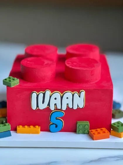 This Lego block cake is made entirely from buttercream, even the round studs on top! I figured out a way to carve and frost spare cake pieces to get the perfect look without using fondant, and I'm so proud of how clean it turned out.