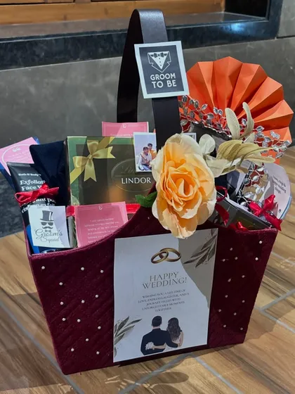 Celebrating the groom-to-be with a hamper designed just for him. This basket includes a mix of his favorite things, from luxury chocolates to personalized items, all styled to honor his big day.