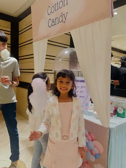 All smiles at the cotton candy station. Our live counters are an interactive experience where guests can watch their treats being made right before their eyes.