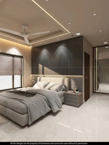 This guest bedroom is designed with a built-in work desk, making it a perfect multi-functional space. The dark accent wall and mirrored wardrobe add a touch of sophistication.