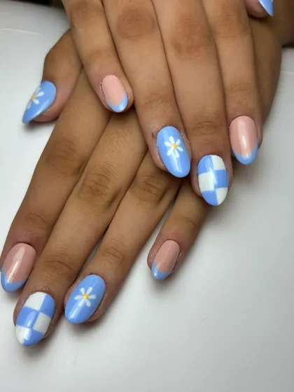 Another look at the celebratory blue and white checkered and floral nail art. A perfect example of combining different patterns in a single manicure.