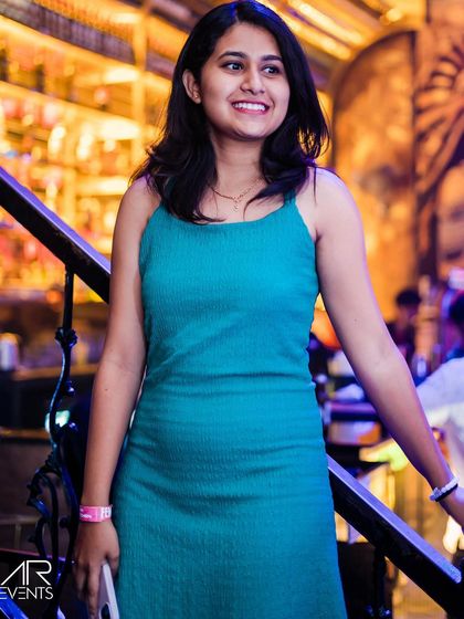 A guest posing on the stairs.