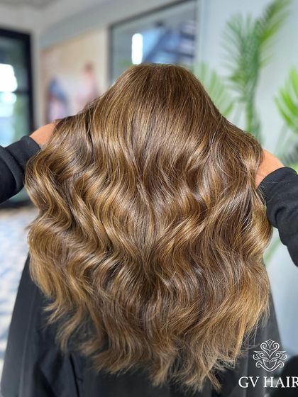 A stunning example of a warm, light brown color with beautiful waves and incredible dimension.