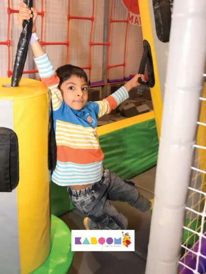 Hanging on tight! This obstacle course element is great for building upper body strength.