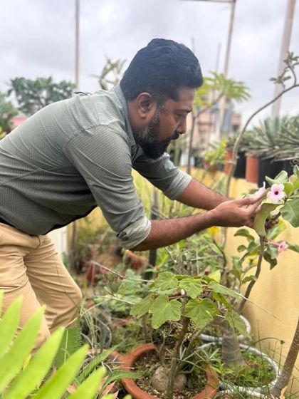 Gardening is a powerful form of self-care. Here, one of our favorite plant lovers tends to his rooftop garden, finding wellness and peace among his plants.