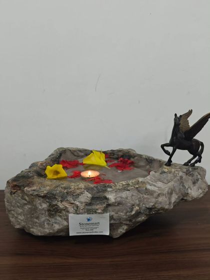 Our natural stone bowls are true pieces of art. This one, with its rugged exterior and smooth interior, is perfect for a luxury console table or as a unique birdbath in the garden.