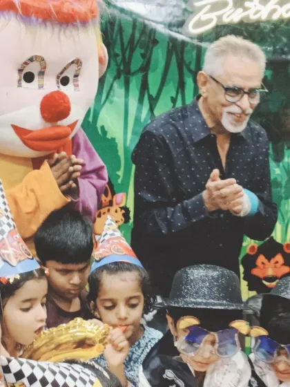 The Joker mascot clapping along during the 'Happy Birthday' song.