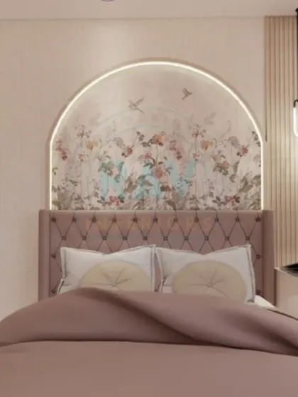 A soft and romantic bedroom design with a tufted pink headboard set against an arched wallpaper panel.