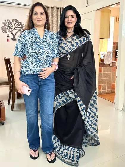 Posing with my cousin, her casual jeans and top create a lovely contrast with my traditional saree look.