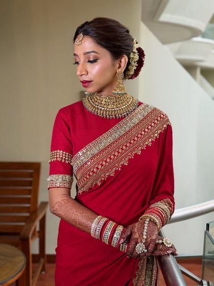 A classic South Indian bridal look featuring a bold red lip and defined eyes. My course covers how to adapt techniques for different regional styles and traditions.