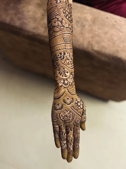 A classic full-hand Indian floral design. The patterns are tightly packed, which is characteristic of traditional bridal mehendi, ensuring a very dark and beautiful stain.