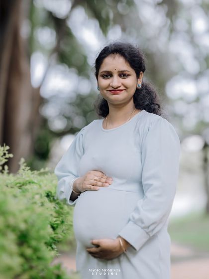 A simple and elegant solo portrait of the mother-to-be. Her calm demeanor and the soft natural light create a timeless and beautiful image.