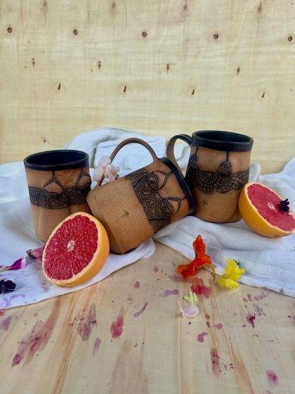 A glimpse of the Déesse mugs and tumblers with vibrant grapefruit. The collection is designed to be both artful and a part of your everyday life.