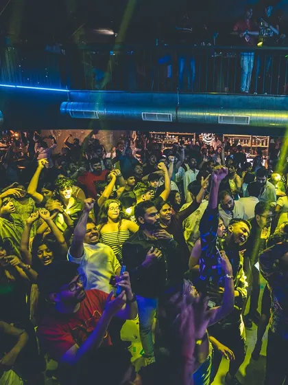 A duplicate of 85, capturing the vibrant, dancing crowd at Flo.