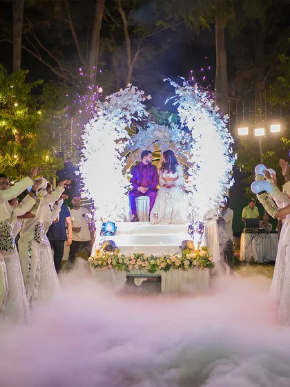 A grand entrance for a spectacular reception. We use dramatic lighting and effects like dry ice to create cinematic shots that make your big moments feel like a movie scene.