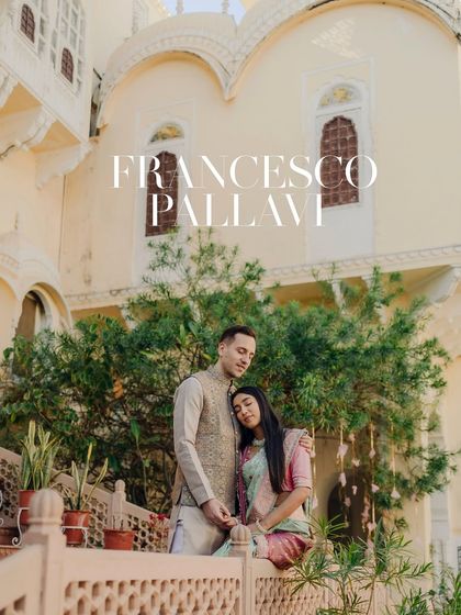 An intimate portrait of the couple on a palace balcony. The bride rests her head on the groom's shoulder, a tender moment that speaks volumes of their love.