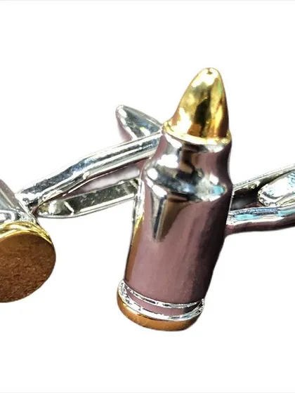 These novelty cufflinks are designed in the shape of bullets, with a two-tone silver and gold finish. They offer a unique and edgy accessory for those with a bold sense of style.
