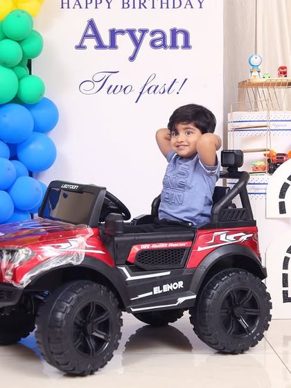 A thrilling 'Spiderman' themed birthday party, with red and blue decor, spiderweb props, and a cityscape backdrop, ready for web-slinging action.