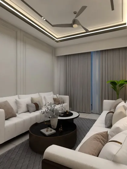 A wide view of a serene living room, featuring clean lines in the ceiling design and wall paneling. The neutral color palette is calming and creates a sense of spaciousness.