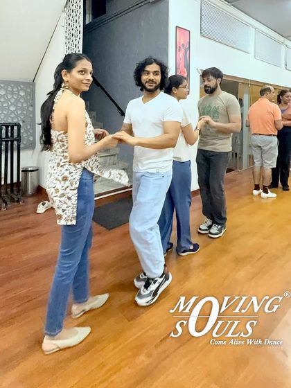 Students practicing their basic hold and connection in a beginner Salsa class. A good frame is the foundation of great partner dancing, and we make sure you learn it right from day one.