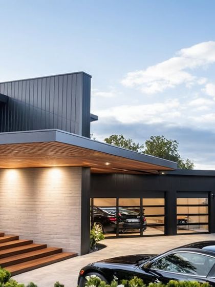 The entryway of this contemporary Seattle bungalow makes a statement with its bold, straight lines and clean, geometric forms. The design focuses on open spaces and fluid transitions, creating an aesthetic that is both impactful and elegantly simple.