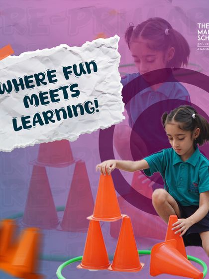 We believe learning should be fun. Here, a student builds a tower with cones, an activity that mixes play with developing fine motor skills and concentration.