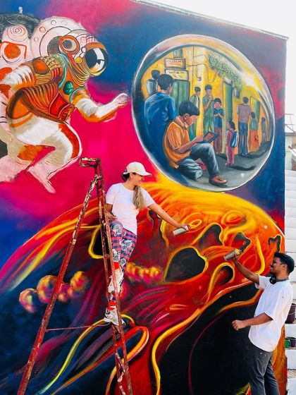 Working on the details of the IIT Bombay mural with my collaborator. Large-scale projects are always a team effort, and the energy we share fuels the final artwork.