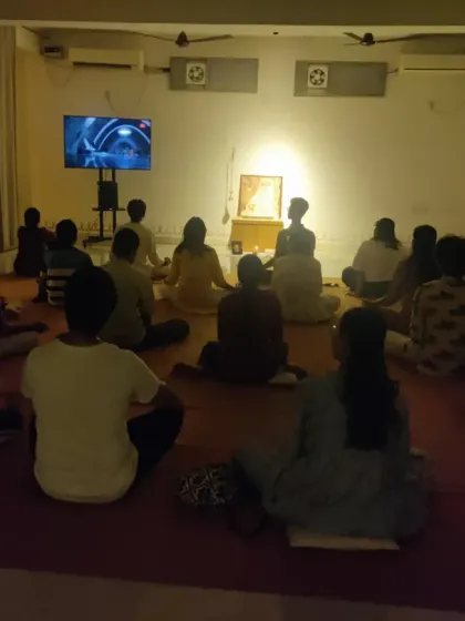 The hall during a Purnima gathering. The collective energy of so many seekers meditating together creates an electric atmosphere.