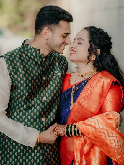 A sweet, romantic moment where the couple shares a loving gaze. Their gentle hold and happy expressions capture the intimacy of their commitment.