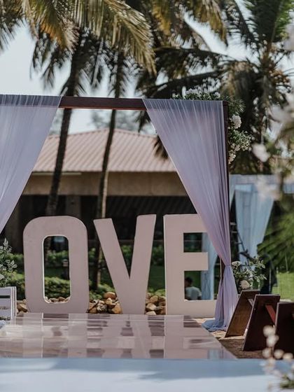 A "LOVE" sign on the beach, creating the perfect photo opportunity and a clear statement for this beautiful Goa wedding.