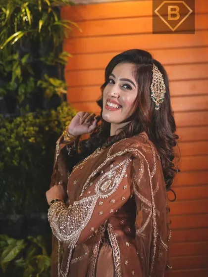 Getting you ready for your big moments is what we do best. This look combines elegant hairstyling with flawless party makeup, ensuring you are the center of attention for all the right reasons.