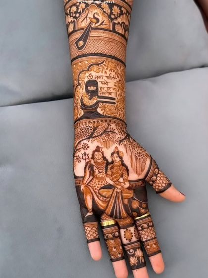 A close-up of the palm from the previous design, showing the detailed portrait of Lord Shiva and Parvati.