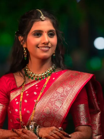 A close-up portrait of this bride's reception look. I created a soft smokey eye and ensured her skin had a flawless, glowing finish that looked stunning under the evening lights.