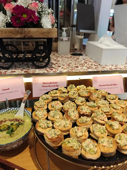 A close-up of the appetizer station from an event. You can see the Khari with Exotic Cheese Broccoli Dip and Chocolate Brownie Slices, showing the variety I offer from savory to sweet for any party menu.