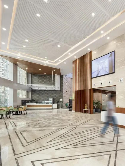 The double-height atrium in this hospital lobby is designed to be a spatial anchor and an emotional reset point. By creating a sense of openness and integrating clear sightlines, we reduce stress and help patients and visitors orient themselves from the moment they arrive.