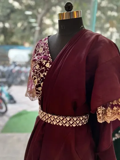 A closer look at the ready-to-wear ruffle saree, showing the detail on the embroidered blouse and the elegant drape of the fabric.