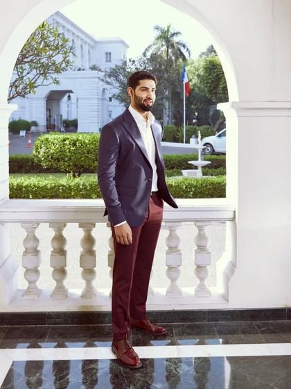 From work to weekend, this sophisticated striped blue linen jacket paired with wine cotton pants is a versatile and stylish combination.