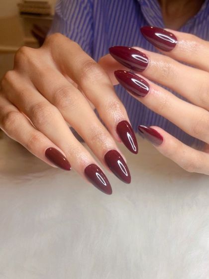 The color of the season: a gorgeous Bordeaux red on soft gel extensions.