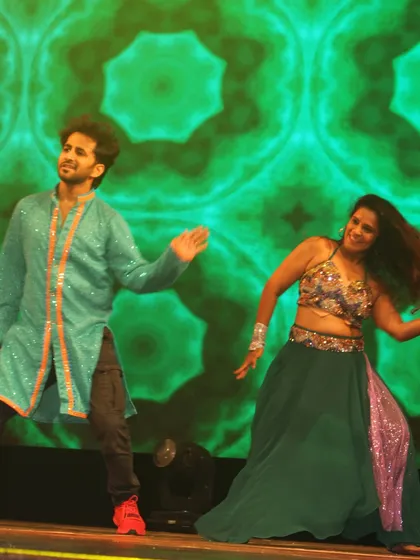 Lost in the moment. A candid shot of me and my dance partner enjoying the performance on stage, with hair flying and big smiles.