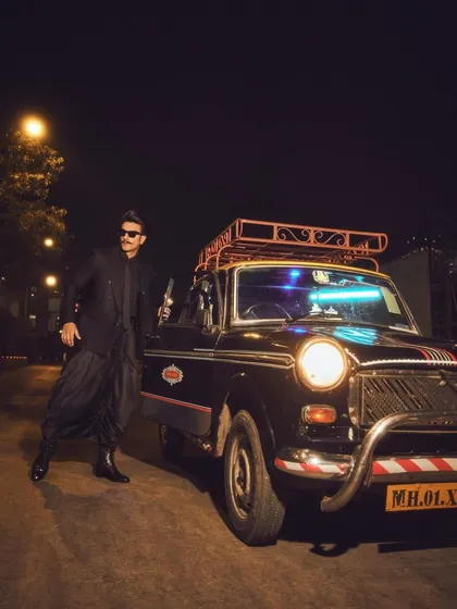 The full look of Ranveer Singh's 'Desi Kalakar' outfit. The combination of a structured blazer with flowing, draped pants creates a unique and modern silhouette for men's formal wear.