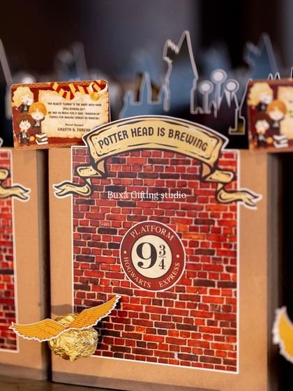 A detailed shot of the Harry Potter hamper box, showing the "Potter Head is Brewing" banner and the iconic Platform 9¾ logo.