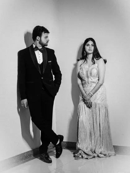 A variation of the modern black and white portrait, capturing a glance between the couple that adds a layer of narrative to the stylish composition.