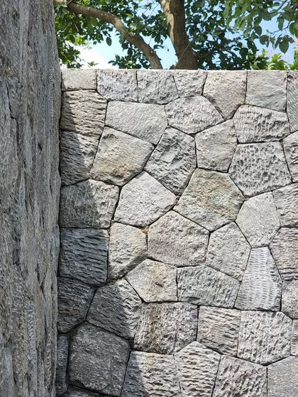 A detail of the random rubble stone masonry at 'Villa 16'. We use local, natural materials to create an architecture that feels born of its place.
