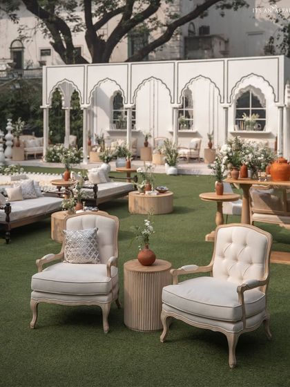 Elegant armchair seating provides a comfortable and stylish space for guests to enjoy the beautiful surroundings.