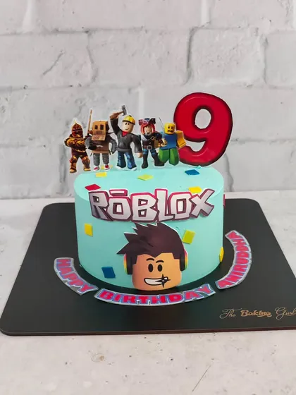 Level up! This Roblox-themed cake was for a 9th birthday celebration. It features the iconic logo, character toppers, and colorful confetti to bring the energy of the game to the party.